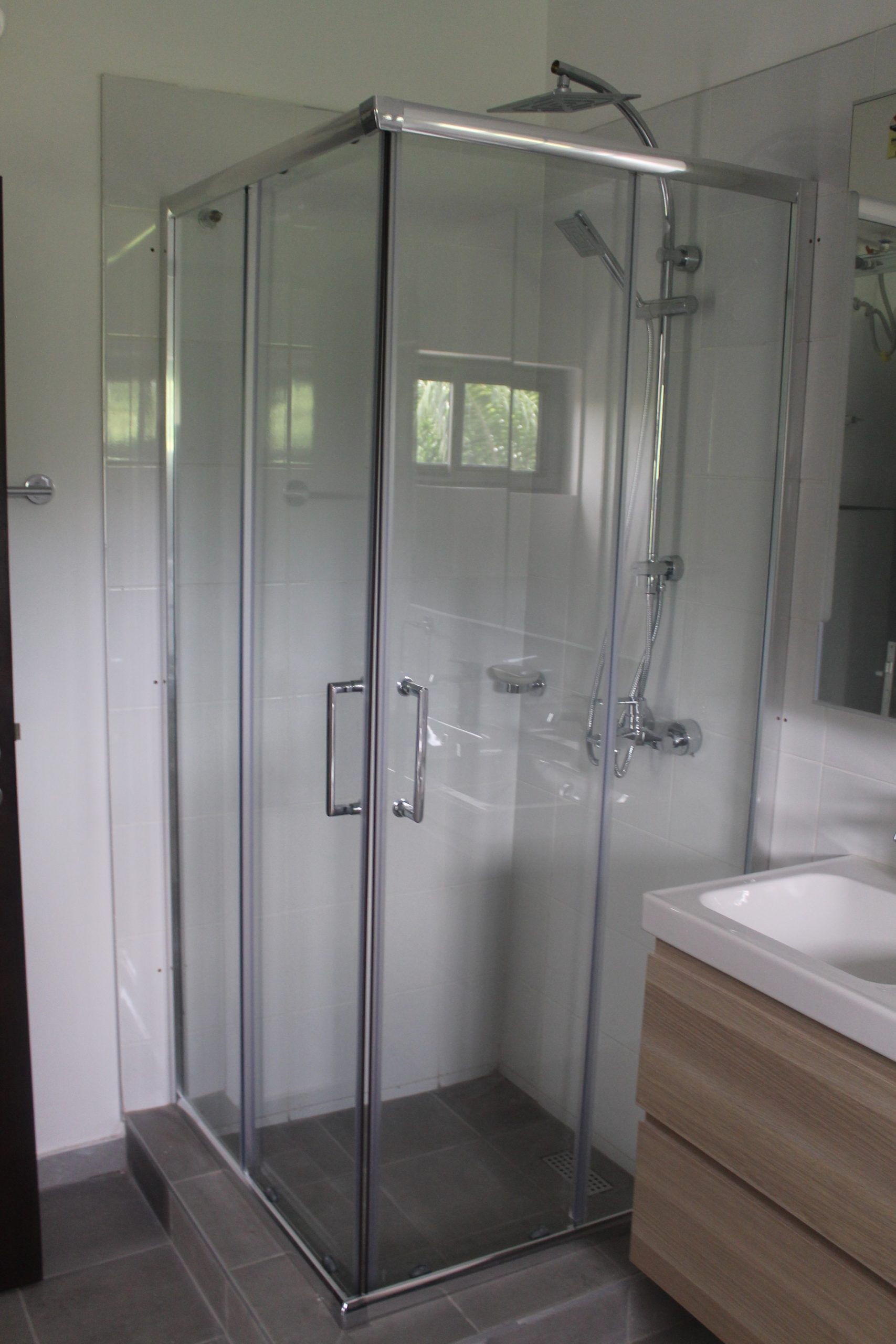 Glass shower enclosure